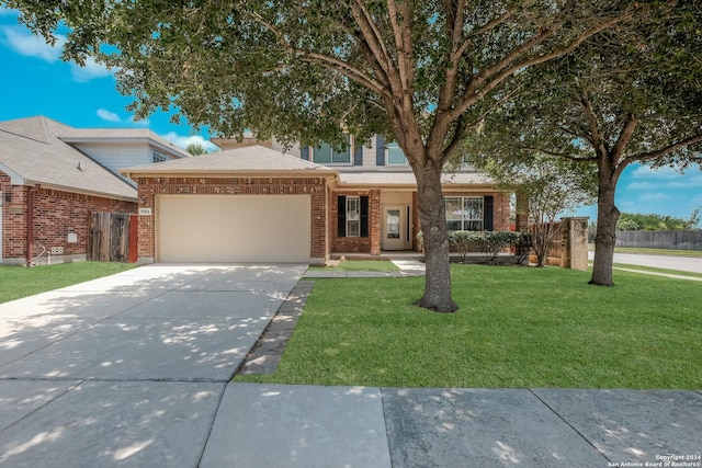 view of front facade with a garage and a front lawn