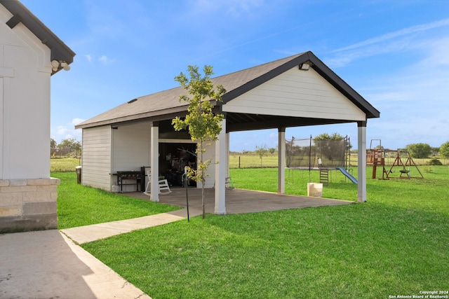 exterior space with a playground and a trampoline