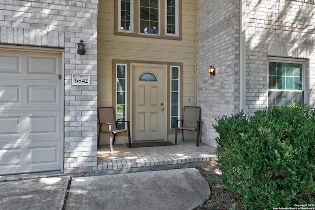 doorway to property featuring a garage