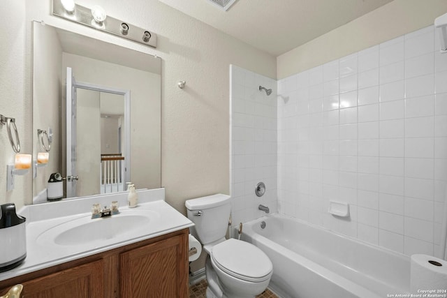 full bathroom featuring vanity, toilet, and tiled shower / bath