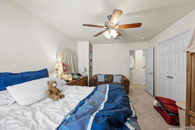 carpeted bedroom with ceiling fan