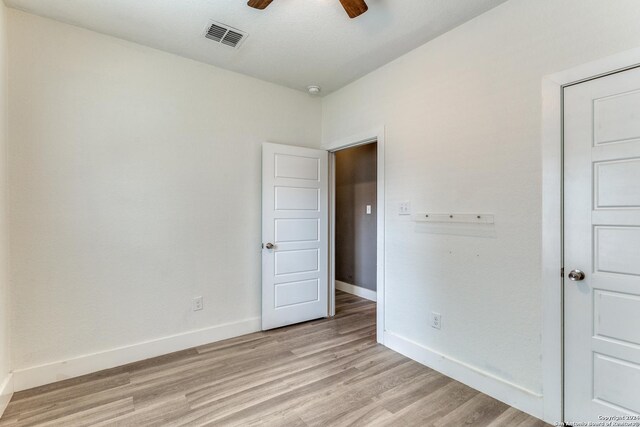 laundry area with washer hookup, light hardwood / wood-style flooring, and hookup for an electric dryer