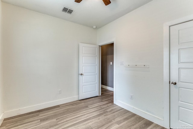 unfurnished room with ceiling fan and light hardwood / wood-style flooring