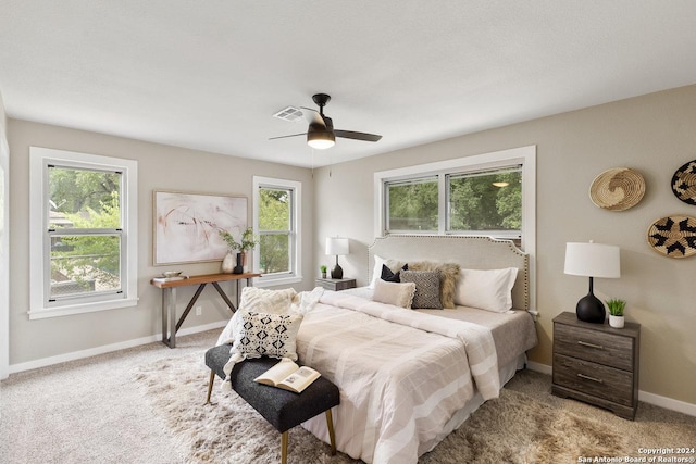 carpeted bedroom featuring ceiling fan