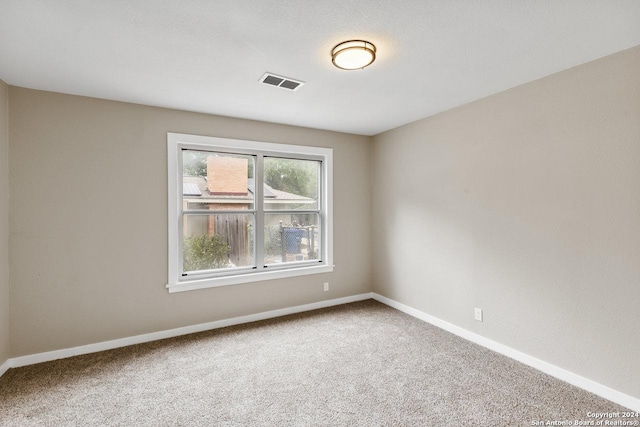 view of carpeted spare room