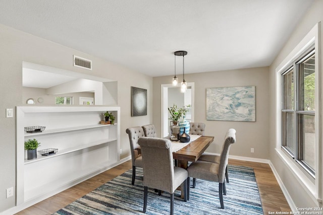 dining space featuring hardwood / wood-style floors