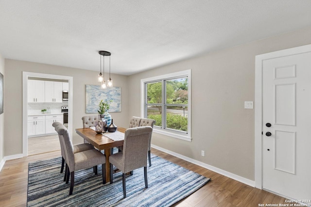 dining area with light wood-type flooring