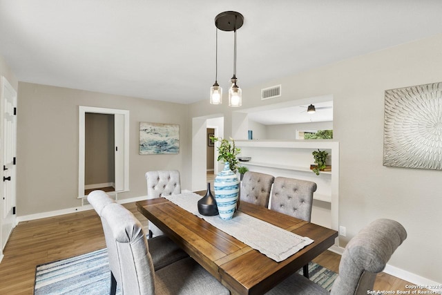 dining space featuring hardwood / wood-style flooring and ceiling fan