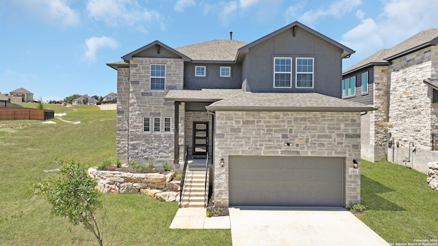 view of front facade featuring a garage and a front lawn