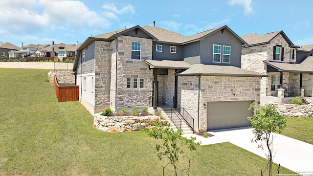 view of front facade with a garage and a front lawn