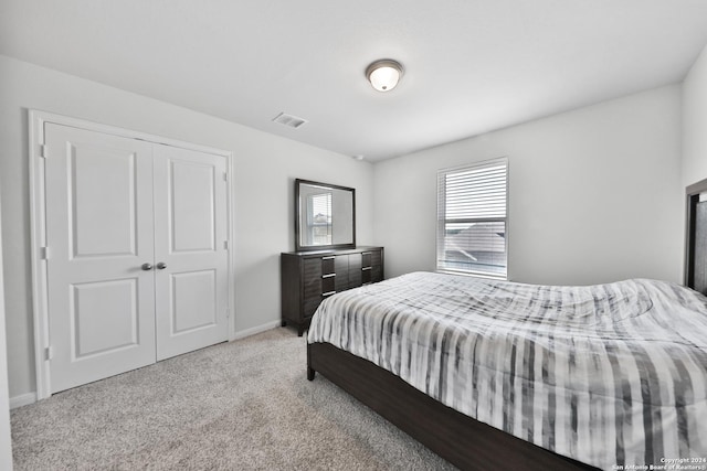 carpeted bedroom with a closet