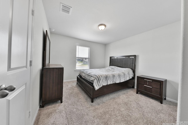 bedroom with light carpet