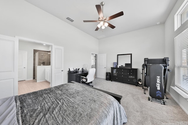 bedroom with light colored carpet, high vaulted ceiling, and ceiling fan