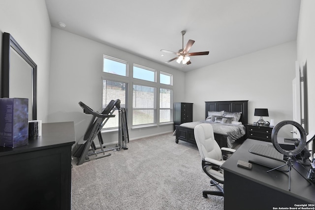 bedroom with ceiling fan and light carpet