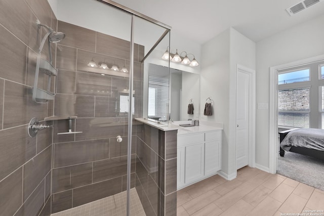 bathroom with vanity and walk in shower