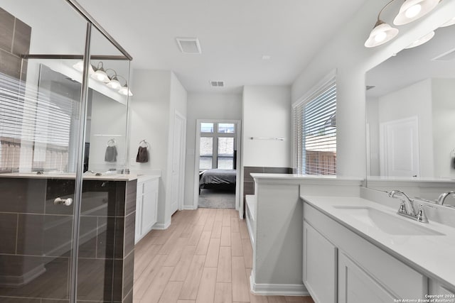 bathroom with plenty of natural light and vanity