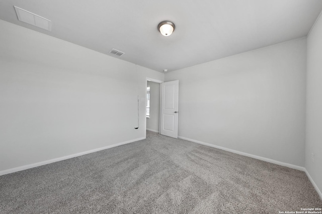 unfurnished room featuring carpet flooring