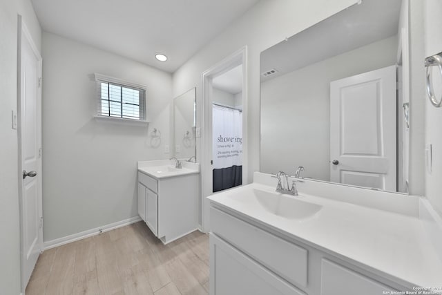 bathroom featuring hardwood / wood-style floors and vanity