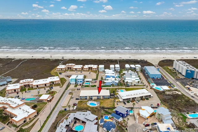 bird's eye view featuring a beach view and a water view