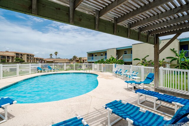 view of pool featuring a patio area and a pergola