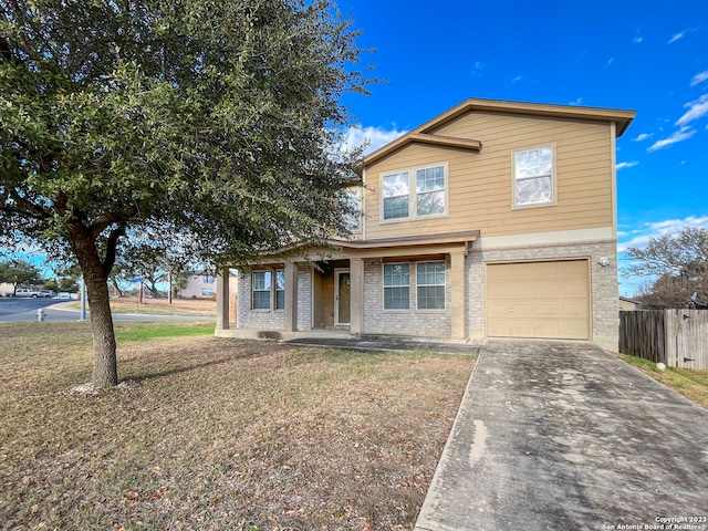 front facade with a garage and a front lawn