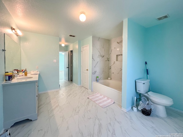 bathroom featuring tile patterned floors, toilet, vanity, and a textured ceiling