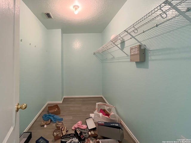 spacious closet featuring hardwood / wood-style floors