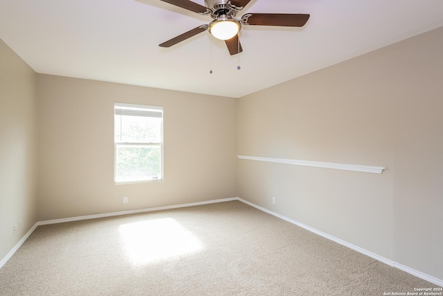 empty room with carpet flooring and ceiling fan