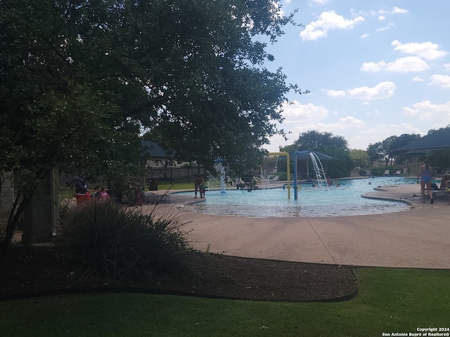 view of pool featuring pool water feature