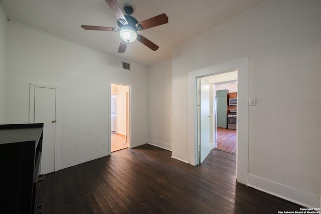 unfurnished living room featuring dark wood-type flooring