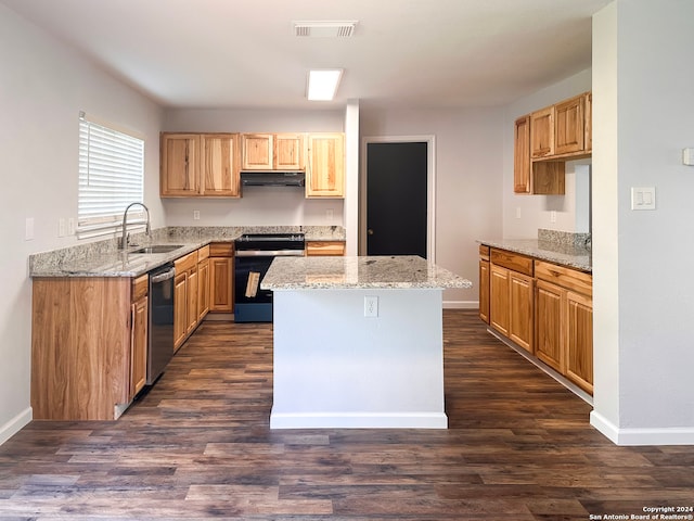 kitchen with sink, light stone counters, electric range oven, stainless steel dishwasher, and a kitchen island