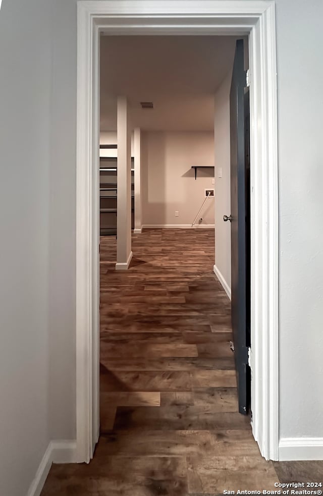 kitchen with extractor fan, electric range, light stone countertops, dark wood-type flooring, and light brown cabinets