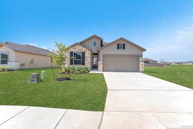 view of front of house featuring a garage and a front yard