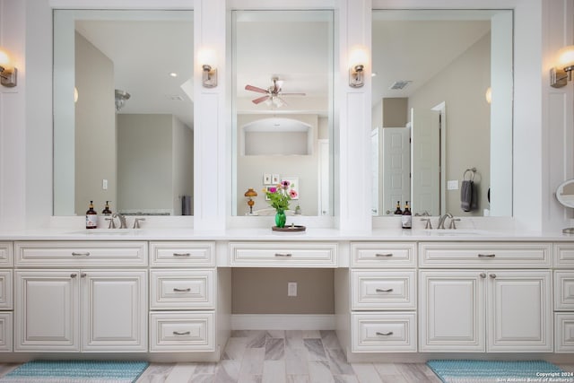 bathroom with ceiling fan and vanity