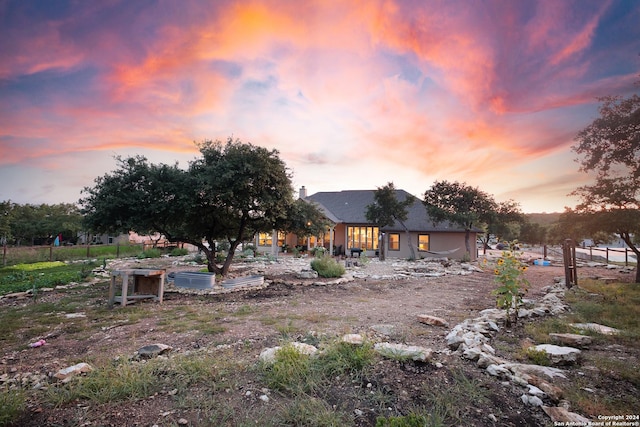 view of yard at dusk