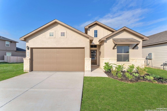 view of front facade featuring a garage and a front lawn