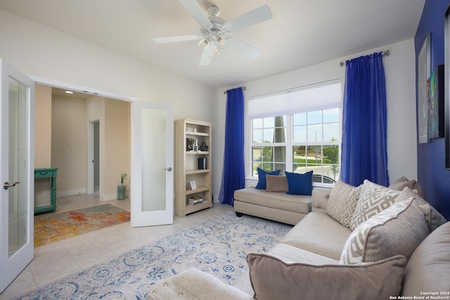 living room with french doors, light tile patterned floors, and ceiling fan