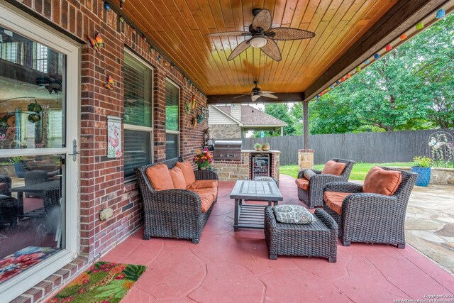 view of patio / terrace featuring ceiling fan, area for grilling, and an outdoor living space