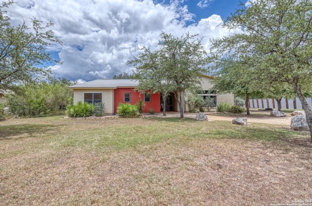 view of front of home with a front lawn