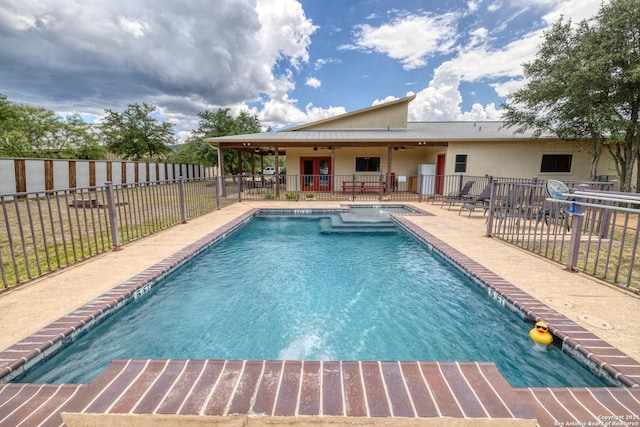 view of pool with ceiling fan and a patio area