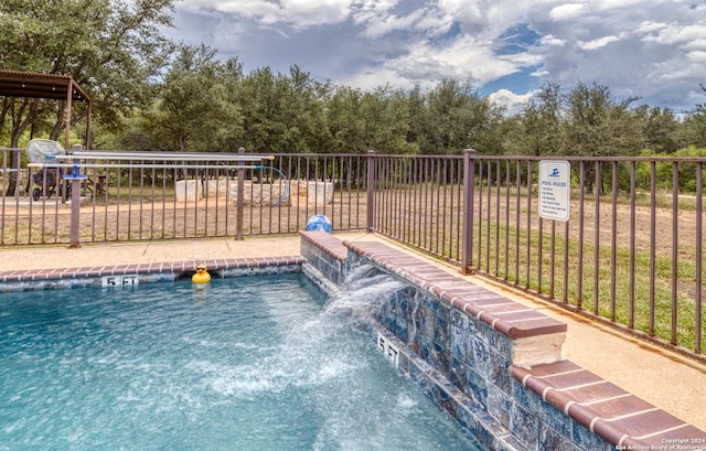 view of pool featuring pool water feature