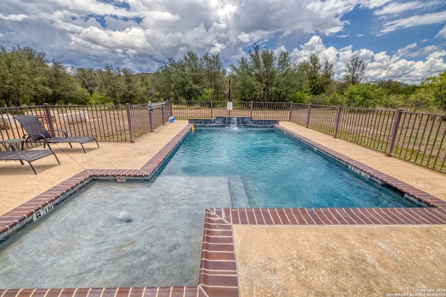 view of swimming pool featuring a patio area and pool water feature