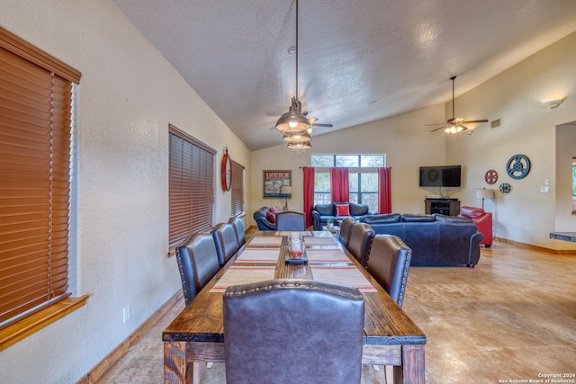 dining room featuring ceiling fan, a textured ceiling, and lofted ceiling