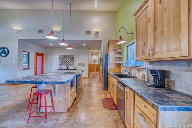 kitchen with sink, light brown cabinets, and stainless steel appliances