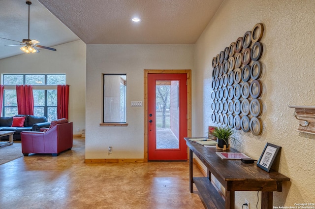 foyer with ceiling fan, concrete floors, and a textured ceiling