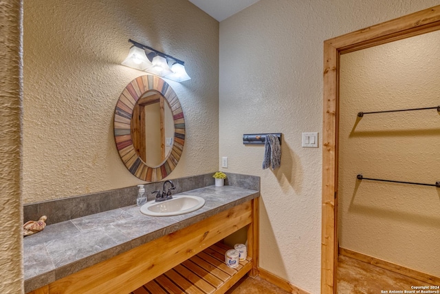 bathroom featuring tile patterned floors and vanity