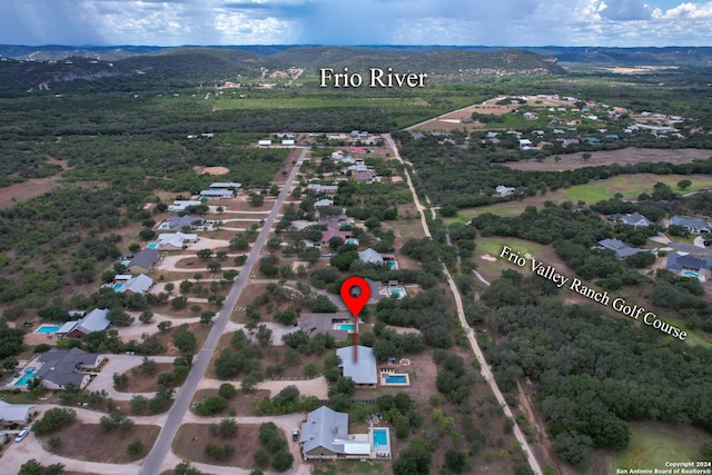 birds eye view of property featuring a mountain view