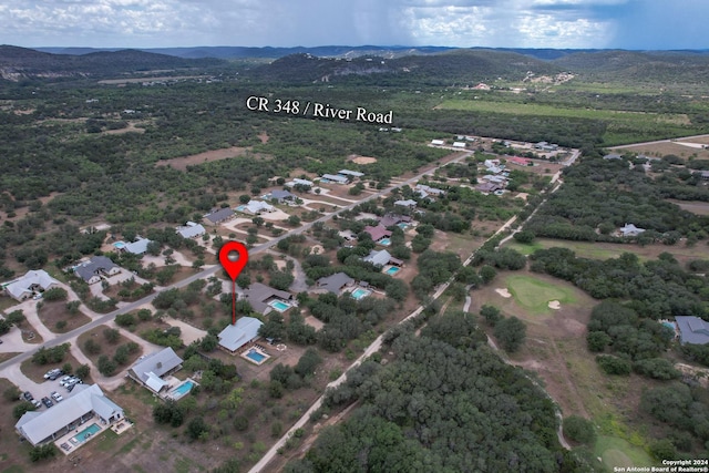 birds eye view of property with a mountain view