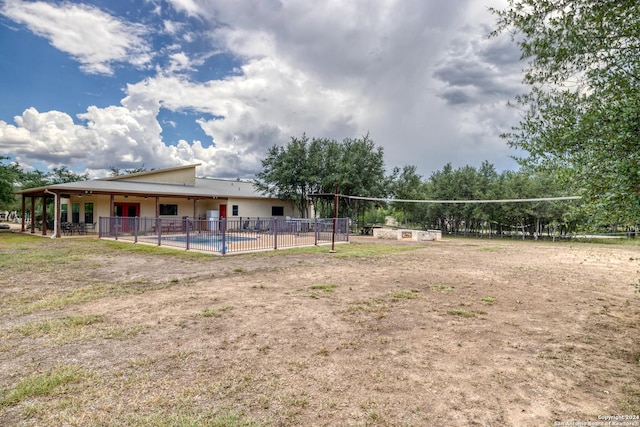 view of community featuring a pool and volleyball court