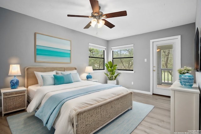 bedroom with ceiling fan, access to exterior, and light hardwood / wood-style flooring